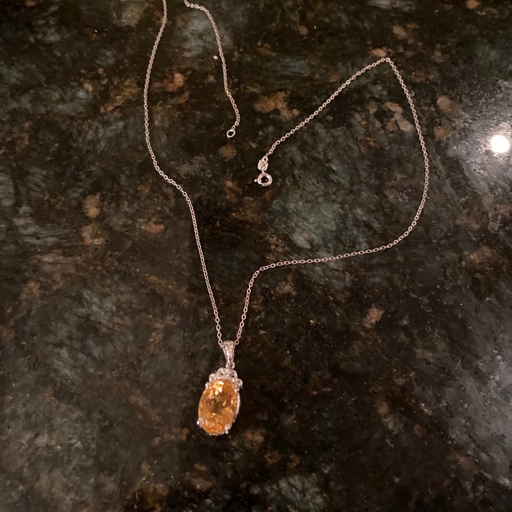 Brand new silver necklace with amber stone